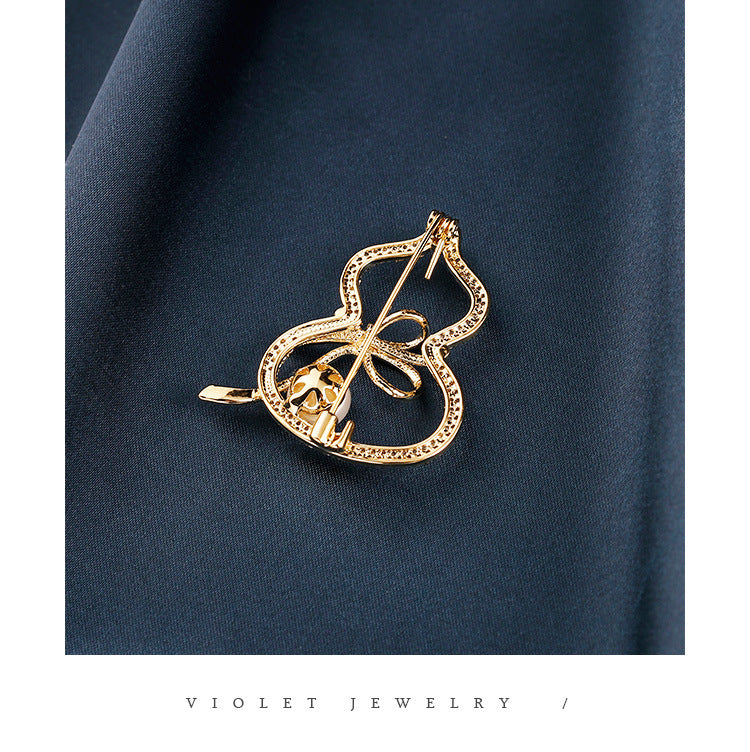 Modern Gourd: Lustrous Pearl Brooch & Gilded Statement Pin