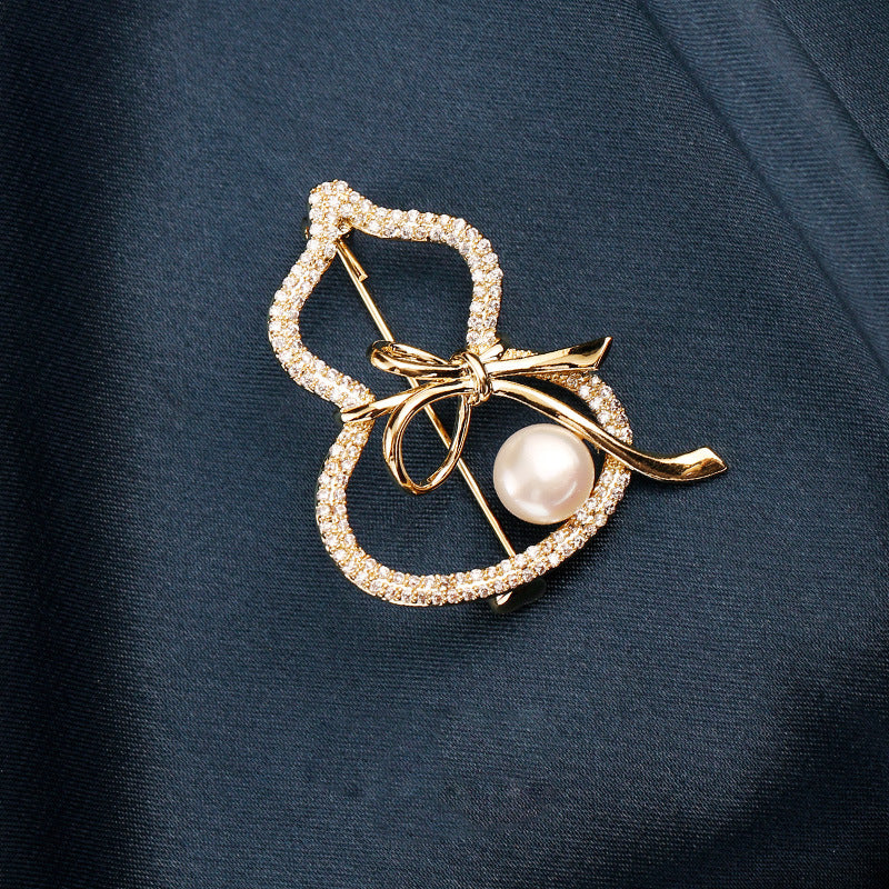 Modern Gourd: Lustrous Pearl Brooch & Gilded Statement Pin