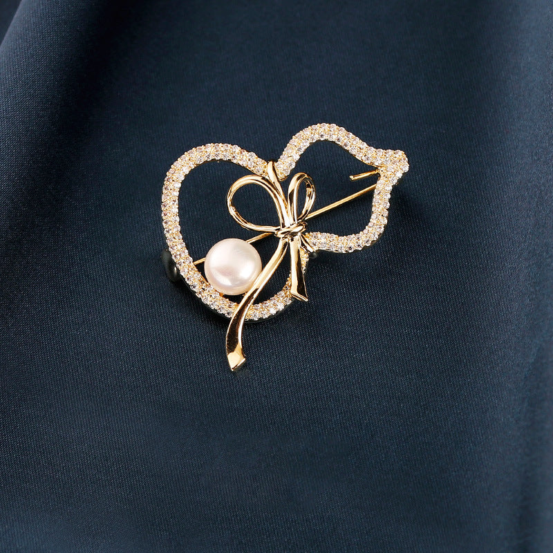 Modern Gourd: Lustrous Pearl Brooch & Gilded Statement Pin