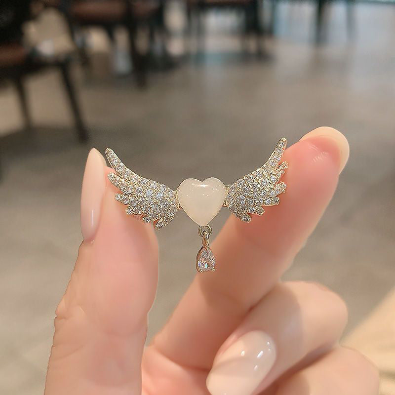 Celestial Wings: Heart & Angel Wing Brooch with Pearl Accents