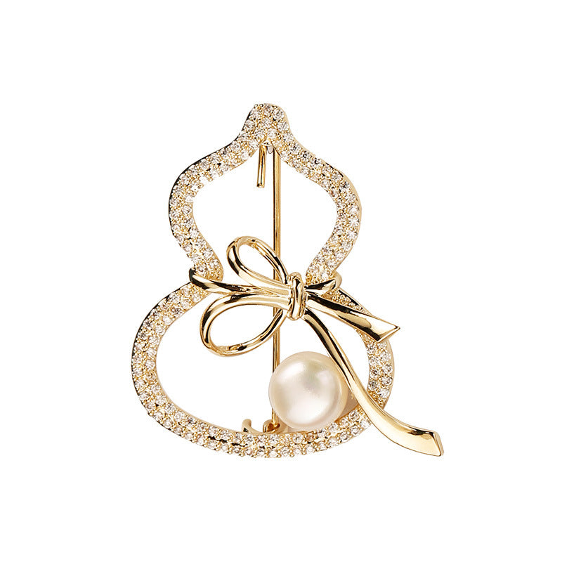 Modern Gourd: Lustrous Pearl Brooch & Gilded Statement Pin