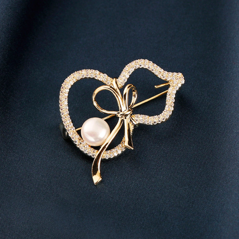 Modern Gourd: Lustrous Pearl Brooch & Gilded Statement Pin