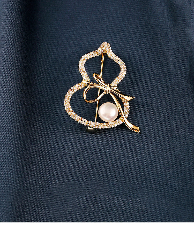 Modern Gourd: Lustrous Pearl Brooch & Gilded Statement Pin